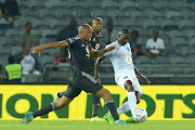 Orlando Pirates midfielder Goodman Mosele and Abel Mabaso fight for the ball during the DStv Premiership at Orlando Stadium in Johannesburg on 8 October 2022.
