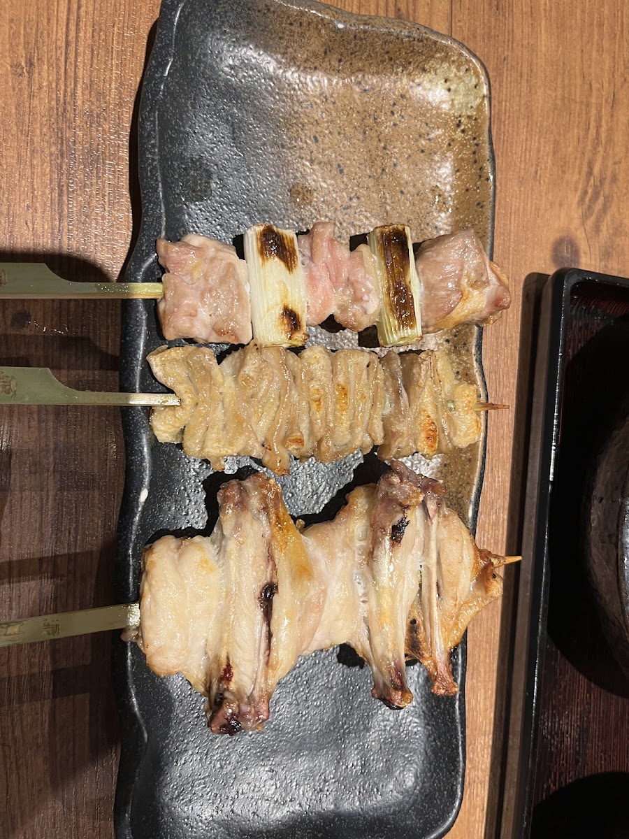 Chicken wings, chicken thigh and green onion, and chicken skin skewers from Torigen