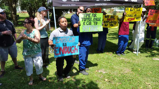 HAD ENOUGH:Permanent staff and contracted builders of Fairlands Old Age Home demonstrate against two residents and their supporters, whom they feel are interfering with the execution of their duties yesterday Picture: MARK ANDREWS