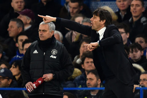 Chelsea's Italian head coach Antonio Conte (R) gestures on the touchline as Manchester United's Portuguese manager Jose Mourinho (L) looks on during the English FA Cup quarter final football match between Chelsea and Manchester United at Stamford Bridge in London on March 13, 2017.
