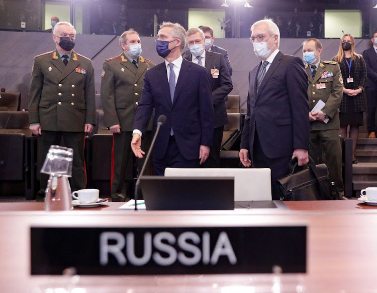 Russian Deputy Foreign Minister Alexander Grushko and NATO Secretary General Jens Stoltenberg are seen during NATO-Russia Council at the Alliance's headquarters in Brussels, Belgium January 12, 2022.