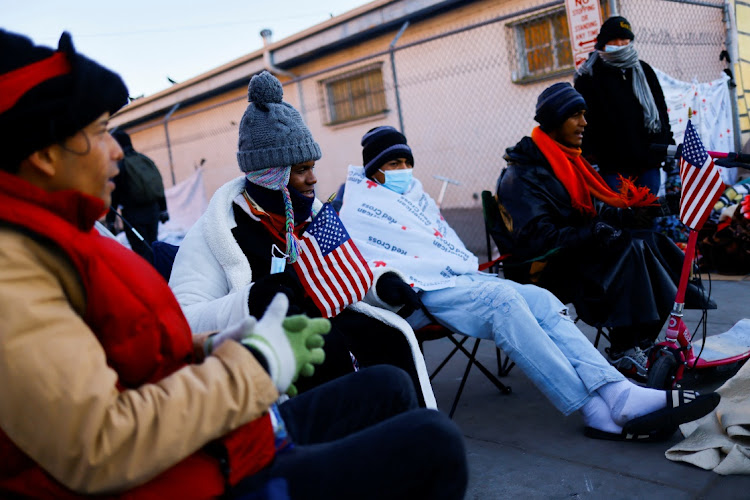 Migrants, mostly from Venezuela, sit in chairs on the day that US President Joe Biden and first lady Jill Biden visited El Paso, in El Paso, Texas, the US, January 8 2023. Picture: JOSE LUIS GONZALEZ/ REUTERS