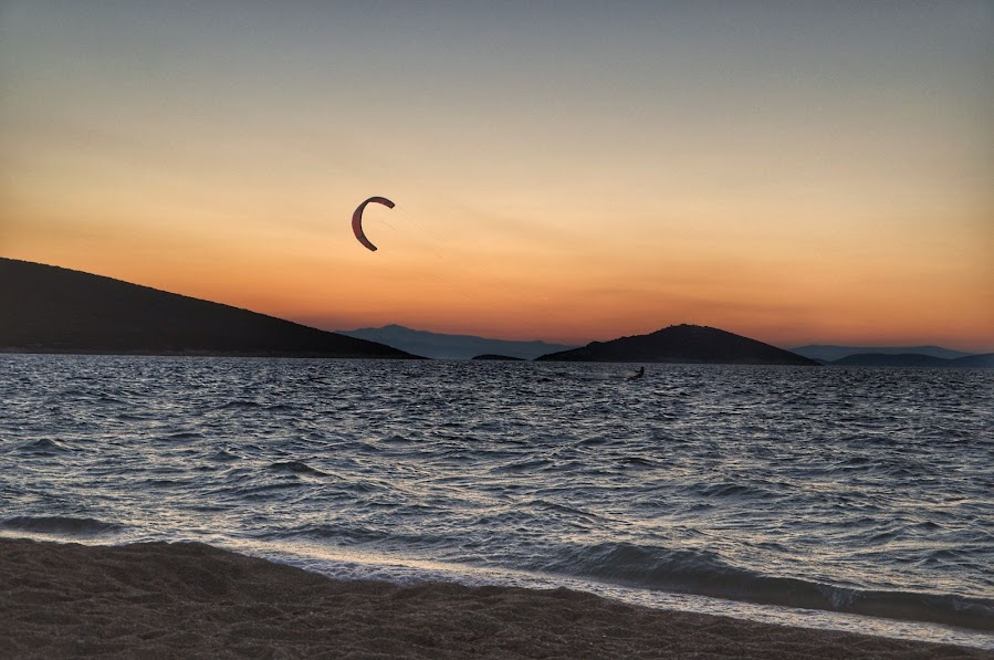 kitesurfing at dusk megali ammos evia greece