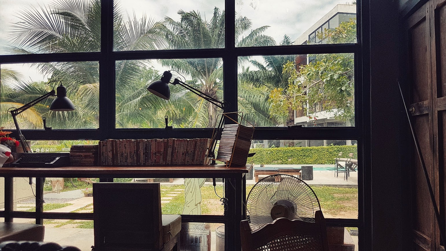 Warehouse 18 Pool & Café
Don Sak
Surat Thani
Thailand
Window with anime books on table