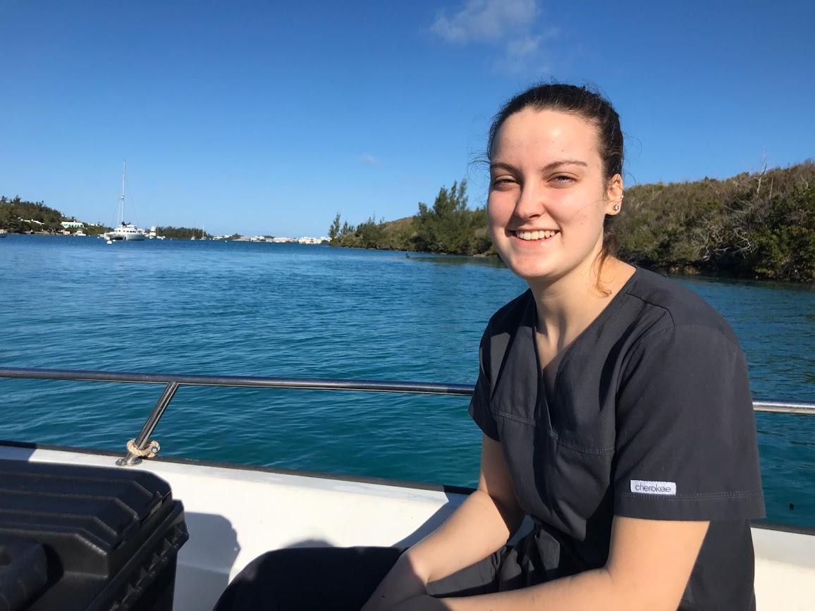 A girl smiling on a boat