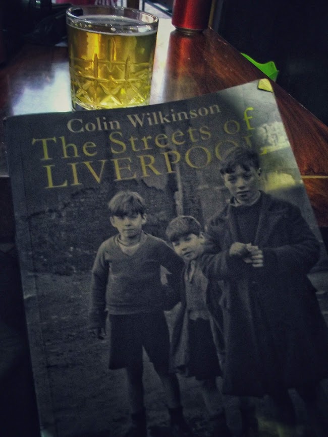 A book titled The Streets of Liverpool by Colin Wilkinson in a Liverpool House bar in Kukes, Albania