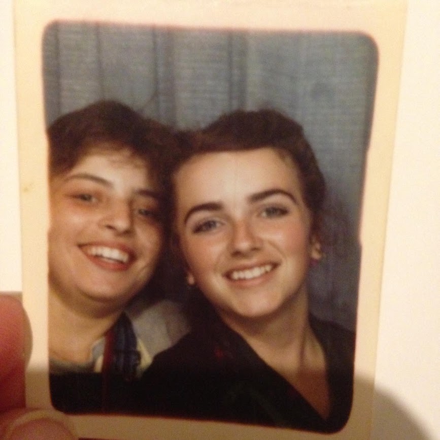 An old photograph taken in 1983 of two veterinary nurses in a photobooth in Liverpool