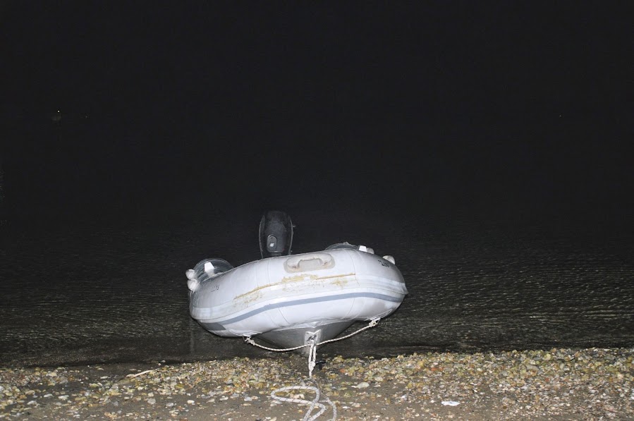 tying dinghy on beach