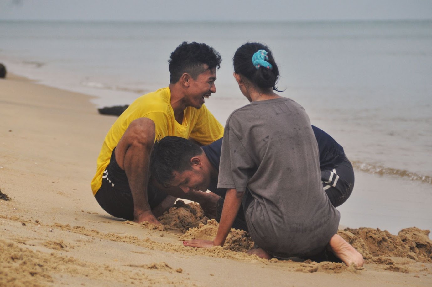 Laem Pho
Pattani Province
Thailand
Beach
Local Thais
Burying friend in sand
Laughter