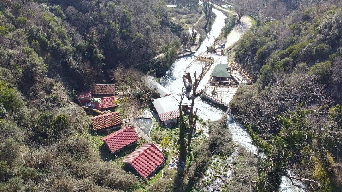 A drone aerial picture of resturants at blue eye, vlora county, albania