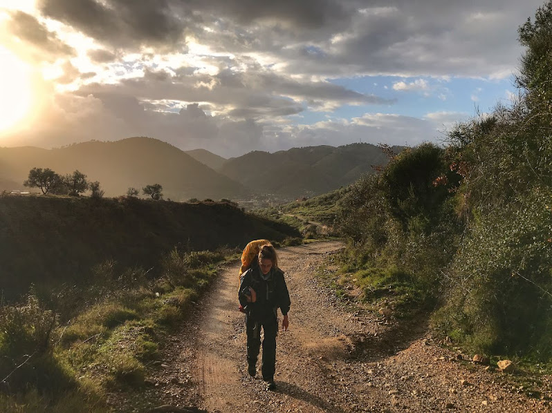 A girl enjoying the brief spells of sunlight while hiking in albania