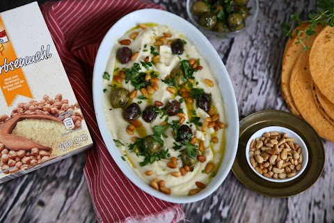 Chickpea Flour Hummus with Olives and Pine Nuts