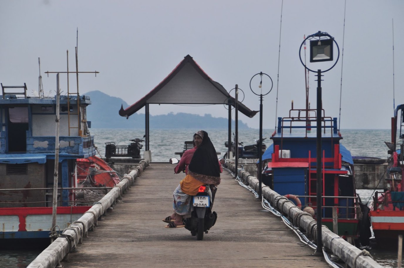 Langu Beach
Satun Province
Thailand
Fishing pier
Lady on a scooter