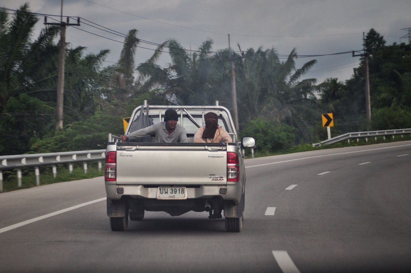 Krabi
Thailand
Driving on the road
Thais in the back of a pick-up-truck