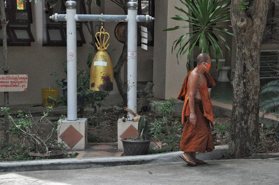 buddhist monk with orange mask