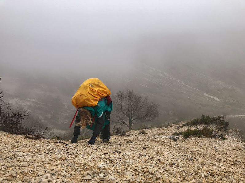 struggling at the last few meters of a steep climb on mount gjere albania 