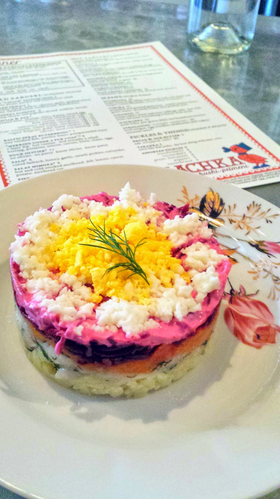 The famous Kachka PDX dish of the Herring Under a Fur Coat, a 7 layer dip but russian. and actually a salad, with herring, potatoes, onions, carrots, beets, mayo, eggs.