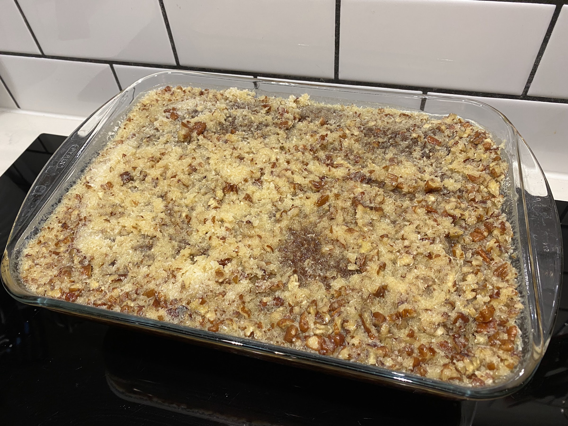 The coconut pecan topping soaking into the cake