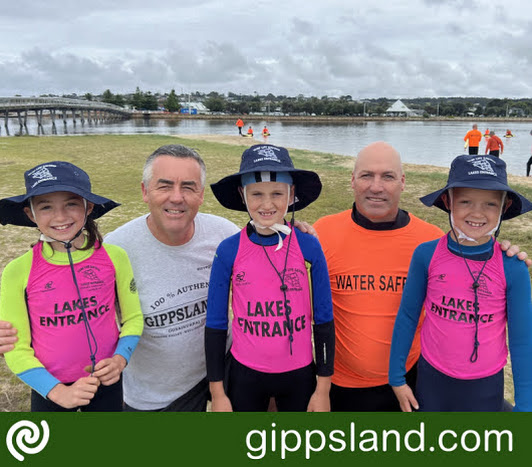 Lakes Entrance nippers (from left) Odette Cook, Ollie Connally and Austin Cook sporting their new broad-brimmed hats with Federal Member for Gippsland Darren Chester and Club President Wally Van Dam