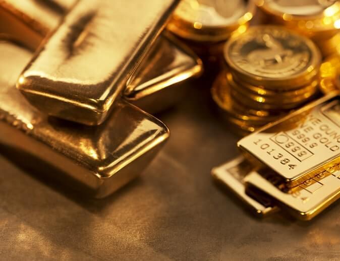 Gold Gains Ground as Dollar and Yields Retreat, But Remains Under Record High