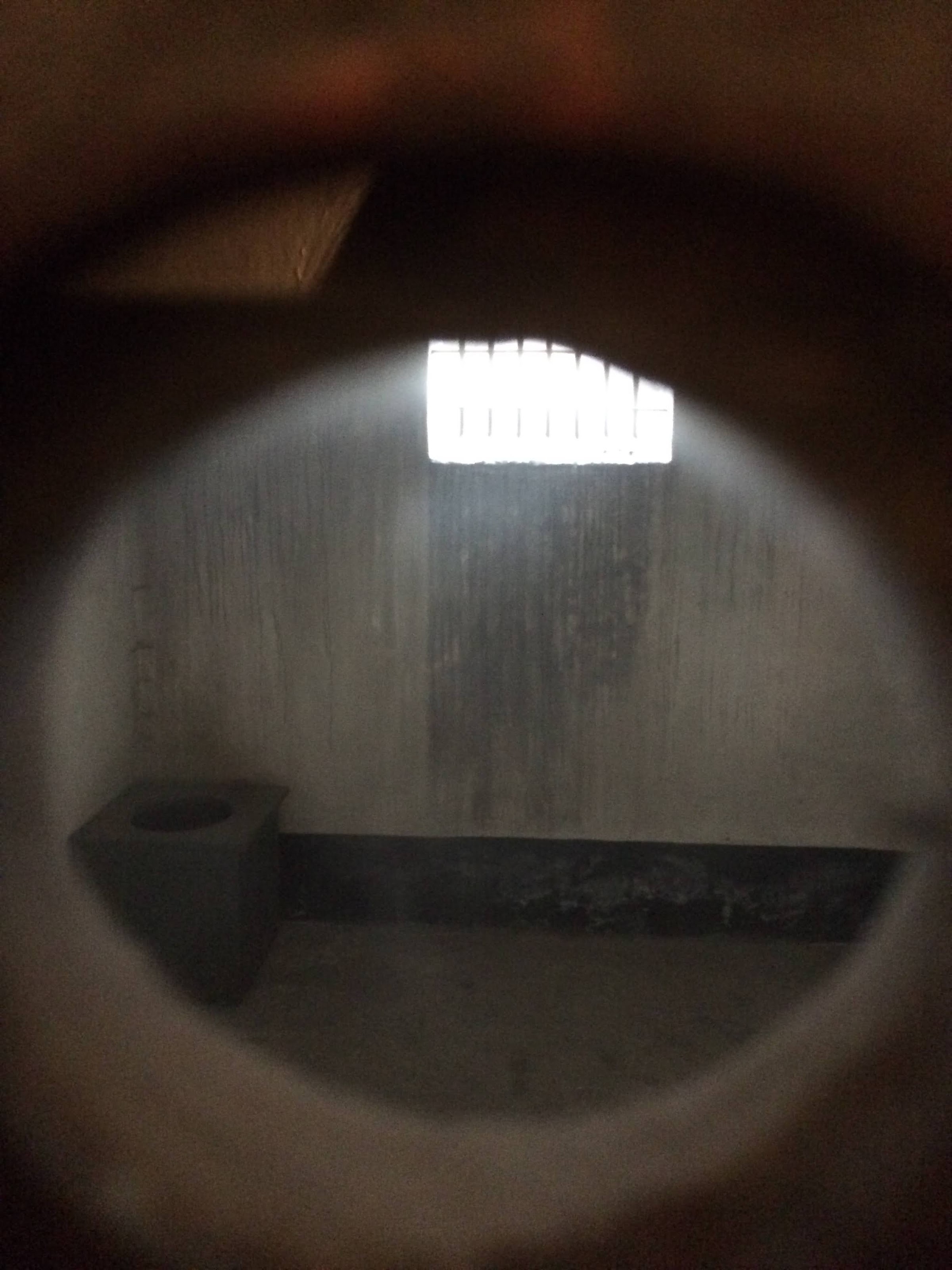 Through an opening into a cell, Auschwitz