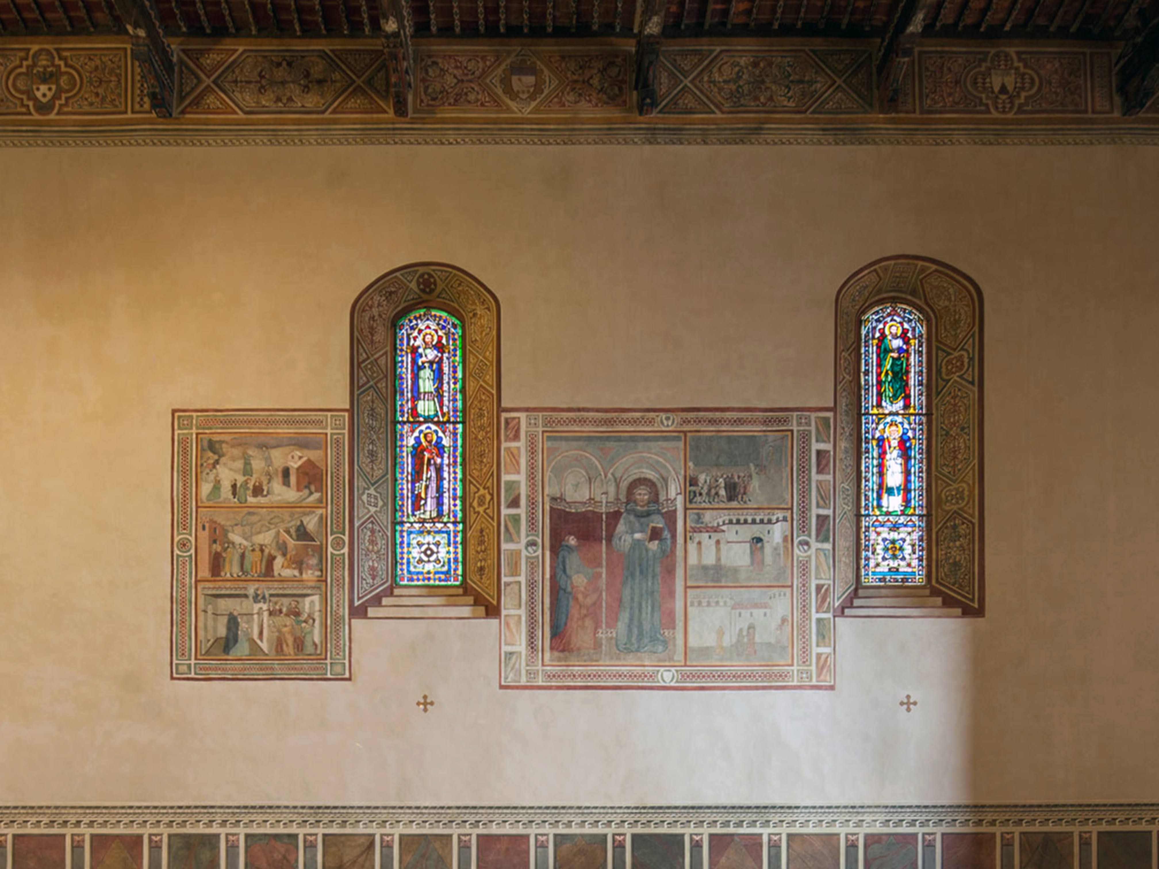 Chiesa di Sant'Agostino, grande riquadro sulla parete sinistra, che mostra al centro la figura di un Santo agostiniano e alcune scene della sua vita (Montalcino)