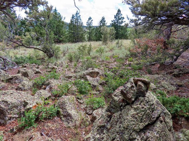 Small cairn marking the only route to the top