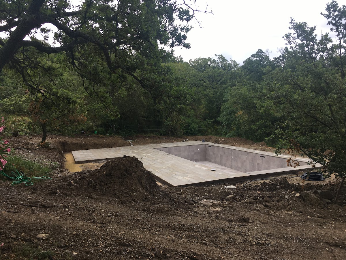 The rough terrain around the pool will be transformed into an enclosed garden