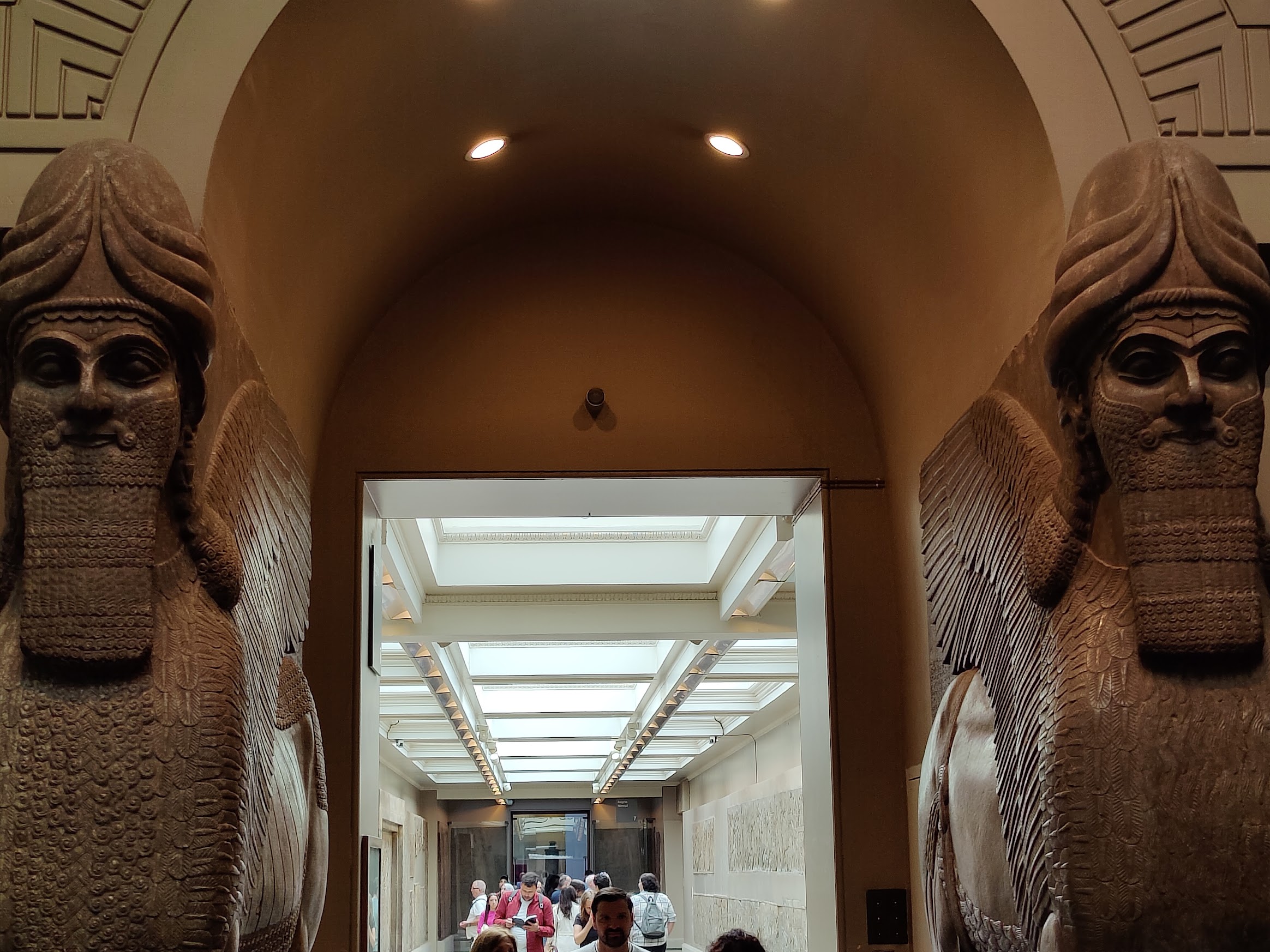 Assyrian gate statues in front of a door