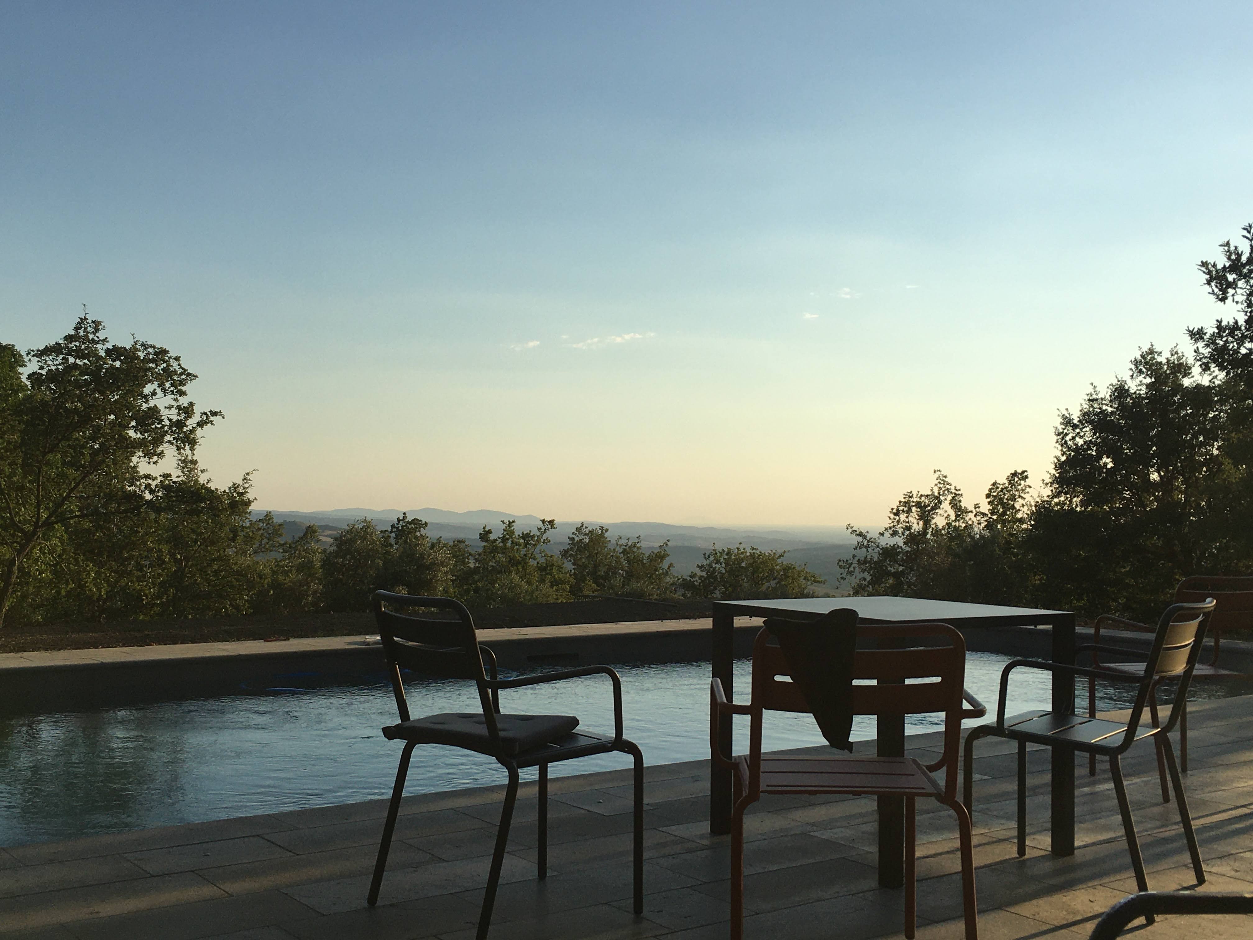 A beautiful early evening by the pool, a natural jewel nestled amidst the verdant Tuscan hills