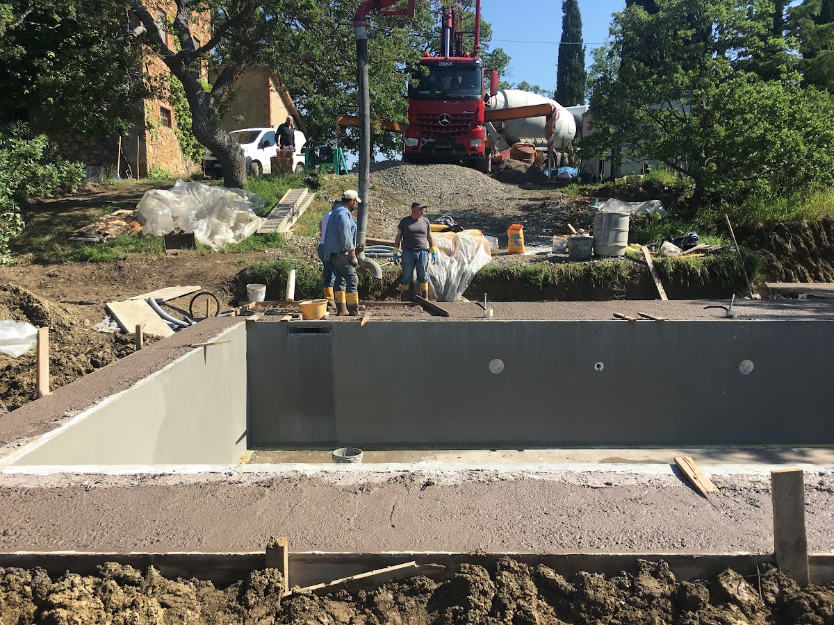 The screeding teamare almost done with the screeding of the surface. Screeding isthe action of flattening poured concrete into a smooth, flat layer prior to finishing the surface