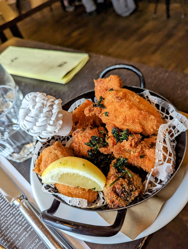 Fried chicken in a dish with a lemon