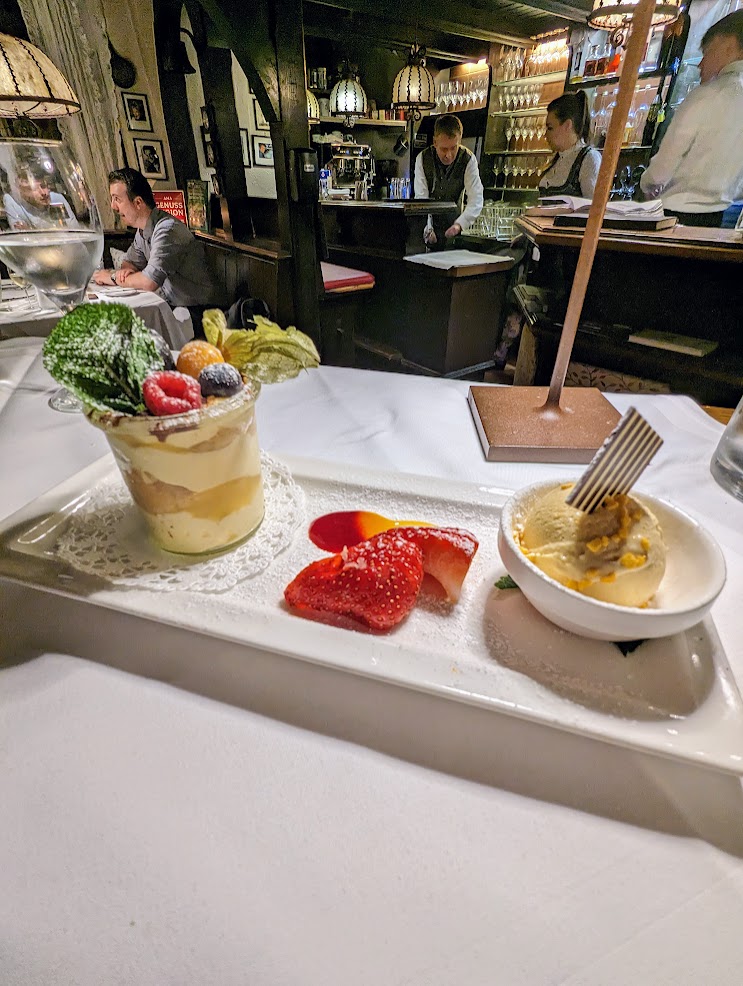 Berries and ice cream in a busy Austrian restaurant