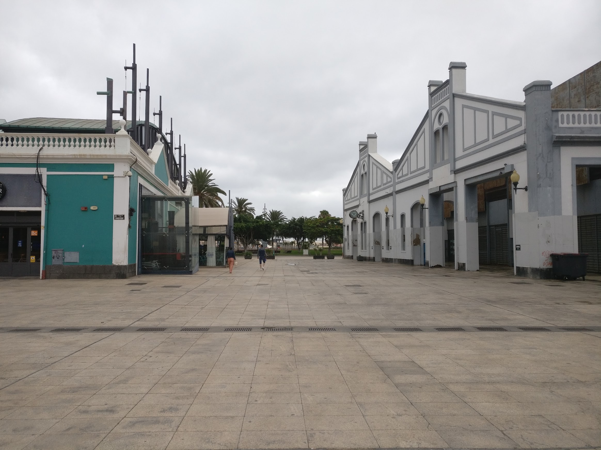 A square near the port, with two small buildings on both sides