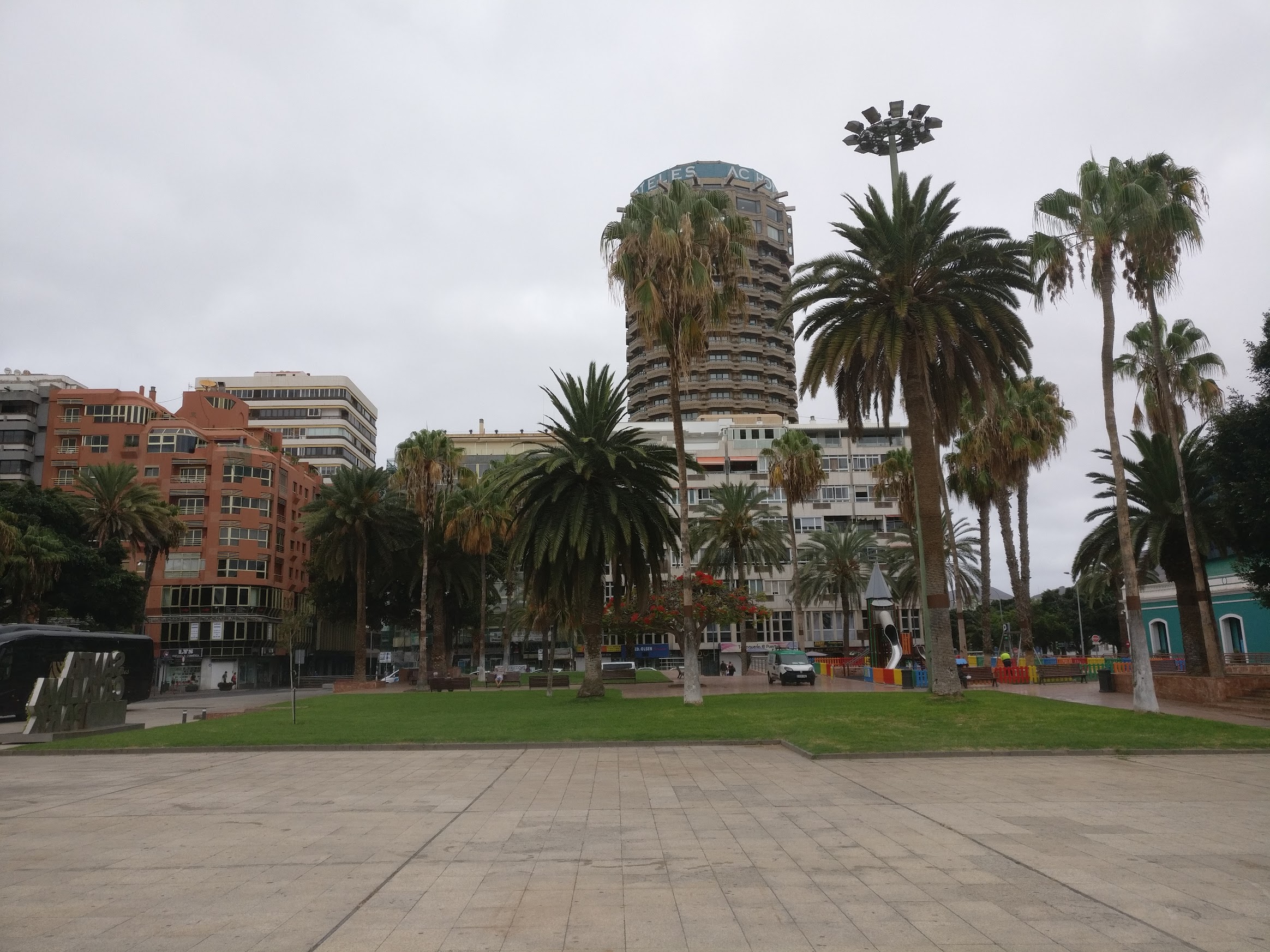 A square with several palm trees