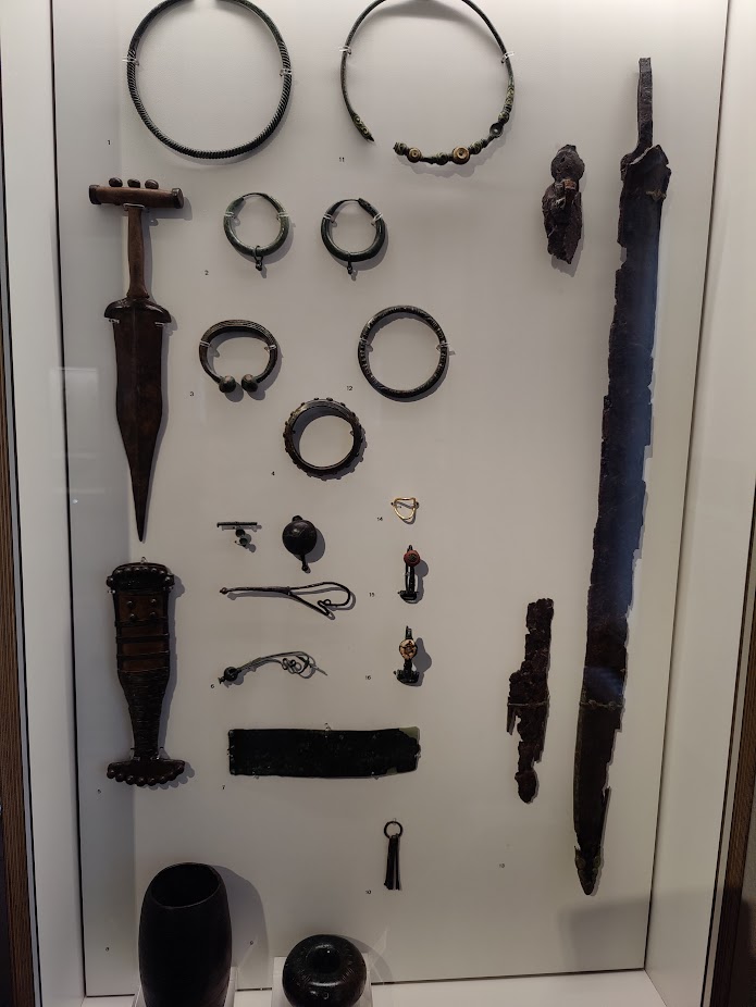 Early metal (I believe bronze) swords and rings