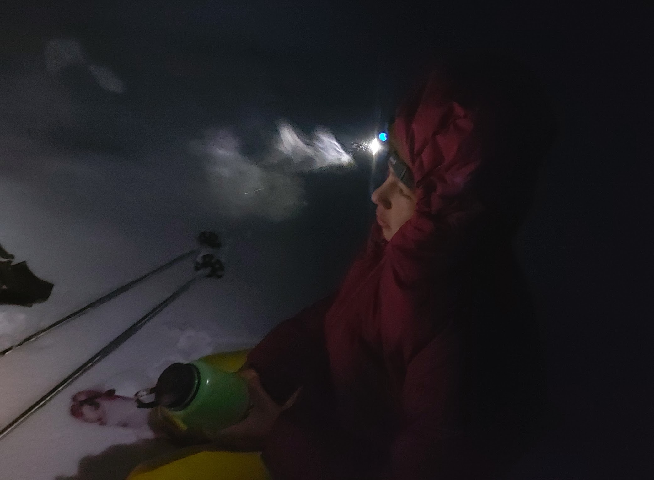 Devlin in the dark, with headlamp and down jacket