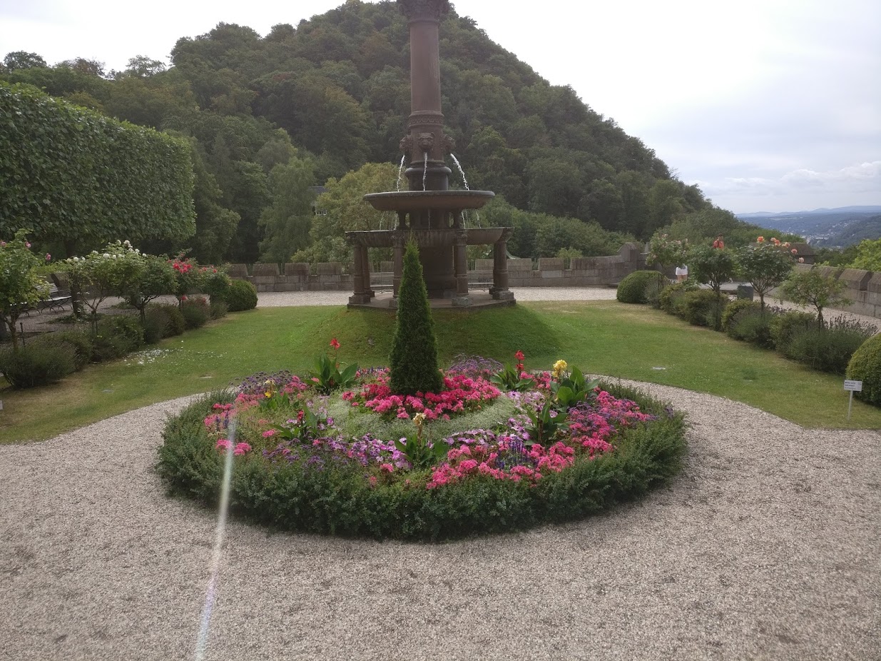 A flower circle and the fountain in the castle garden