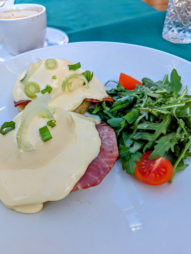 Eggs Benedict on white plate