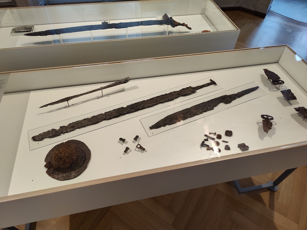 Metal (I believe bronze) swords, and also one arrow