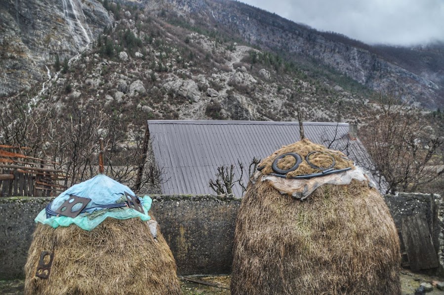 2 large piles of straw in Nikc, Shkoder County, Albania