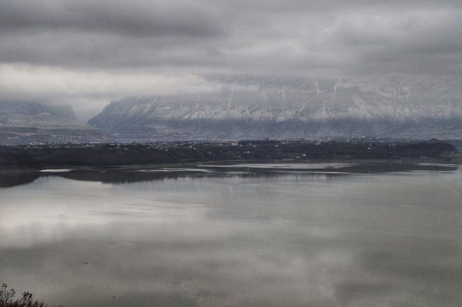 Snowy mountains, a lake and Kukes city in Albania