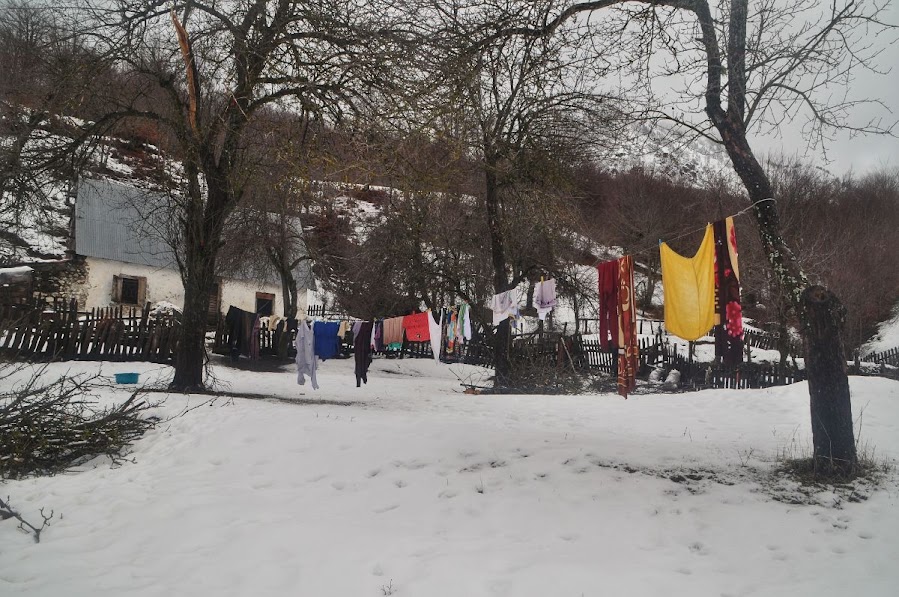 A washing line in front of house, in the snow in Vermosh Valley, Shkoder County, Albania in the winter.