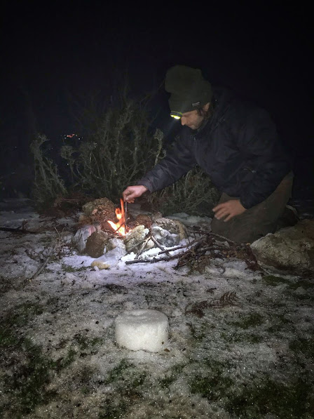 A man making fire in Bajram Curri, Kukes County, Albania