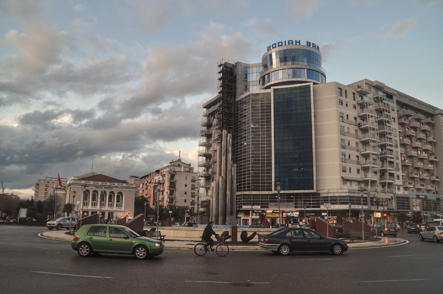 A roundabout in Shkoder City, Albania. Tall buildings are in the background.