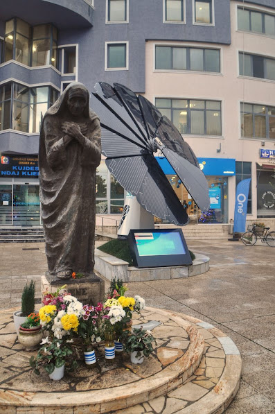 A statue of Mother Teressa and a solar flower panel in Shkoder City
Albania