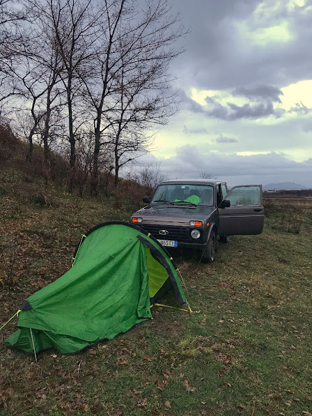 A car and a tent parked near Shkoder Lake, Nature Reserve, Shkoder County, Albania