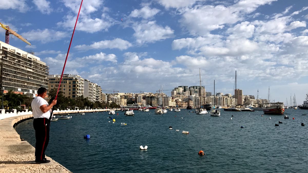 sliema malta man fishing