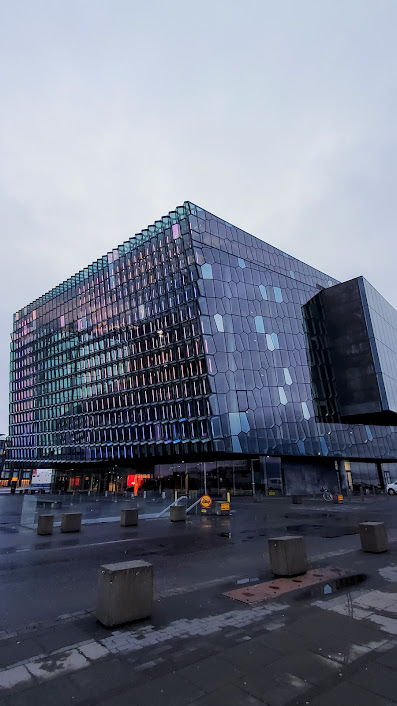 In Reykjavik Iceland, one early morning thing to do that is free is visiting Harpa Concert Hall. The honeycomb glass exterior is mesmerizing how the windows change colors in daylight or in the night.