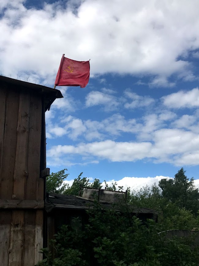 soviet flag on russian village house near ladoga lake in 2018